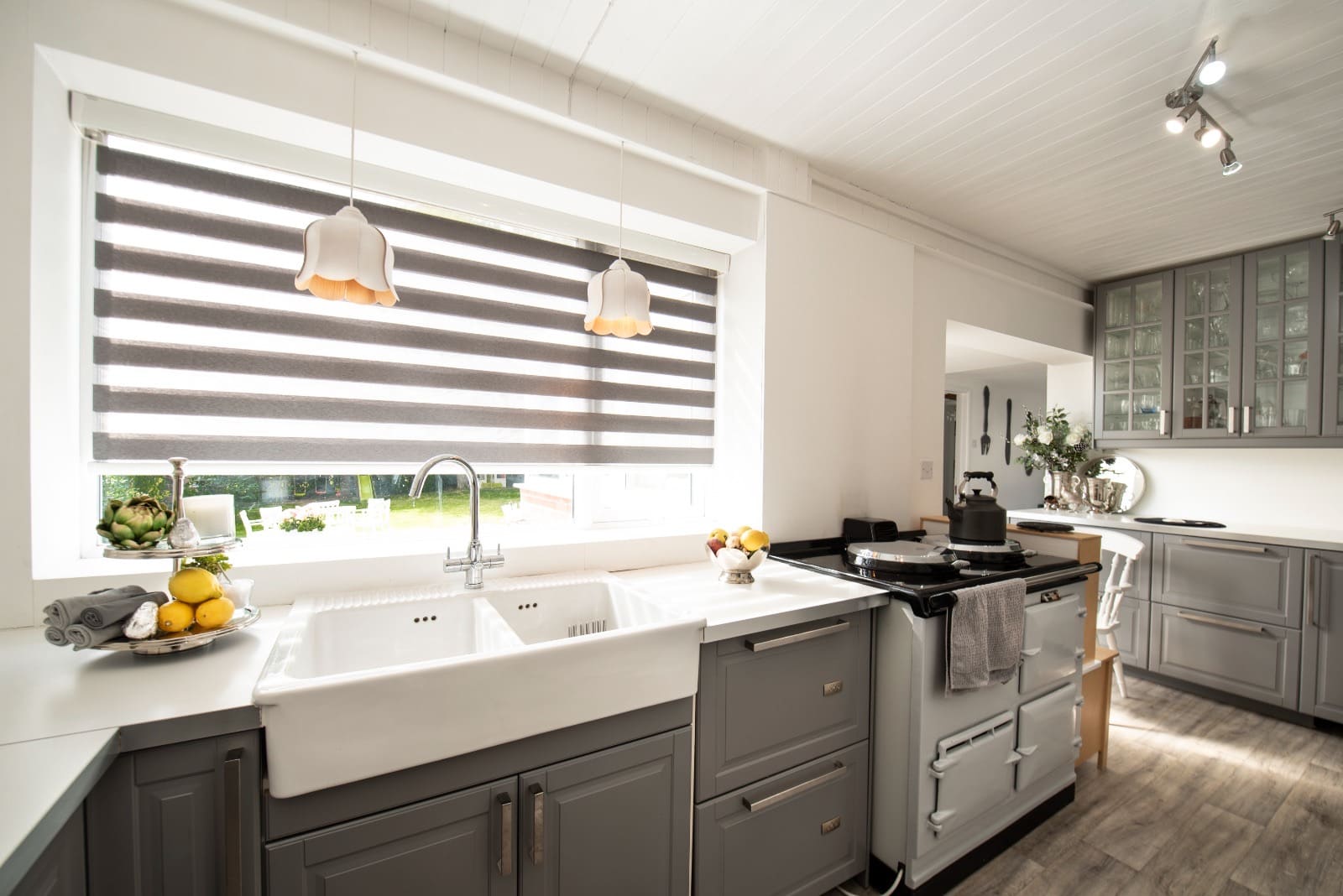 Day and night blind fitted in a traditional kitchen with an Aga